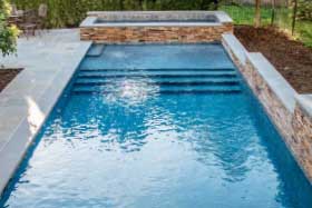 Gunite swimming pool with tanning ledge built by Eastern Aquatics in Catskill NY
