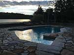 Freeform swimming pool with flagstone coping